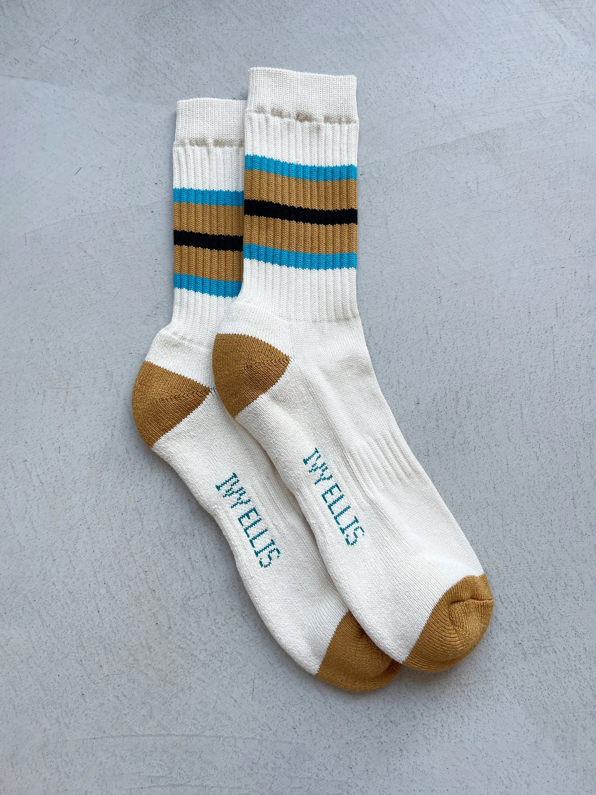 The Dellucci men's crew length socks in cream with blue, brown and black stripes