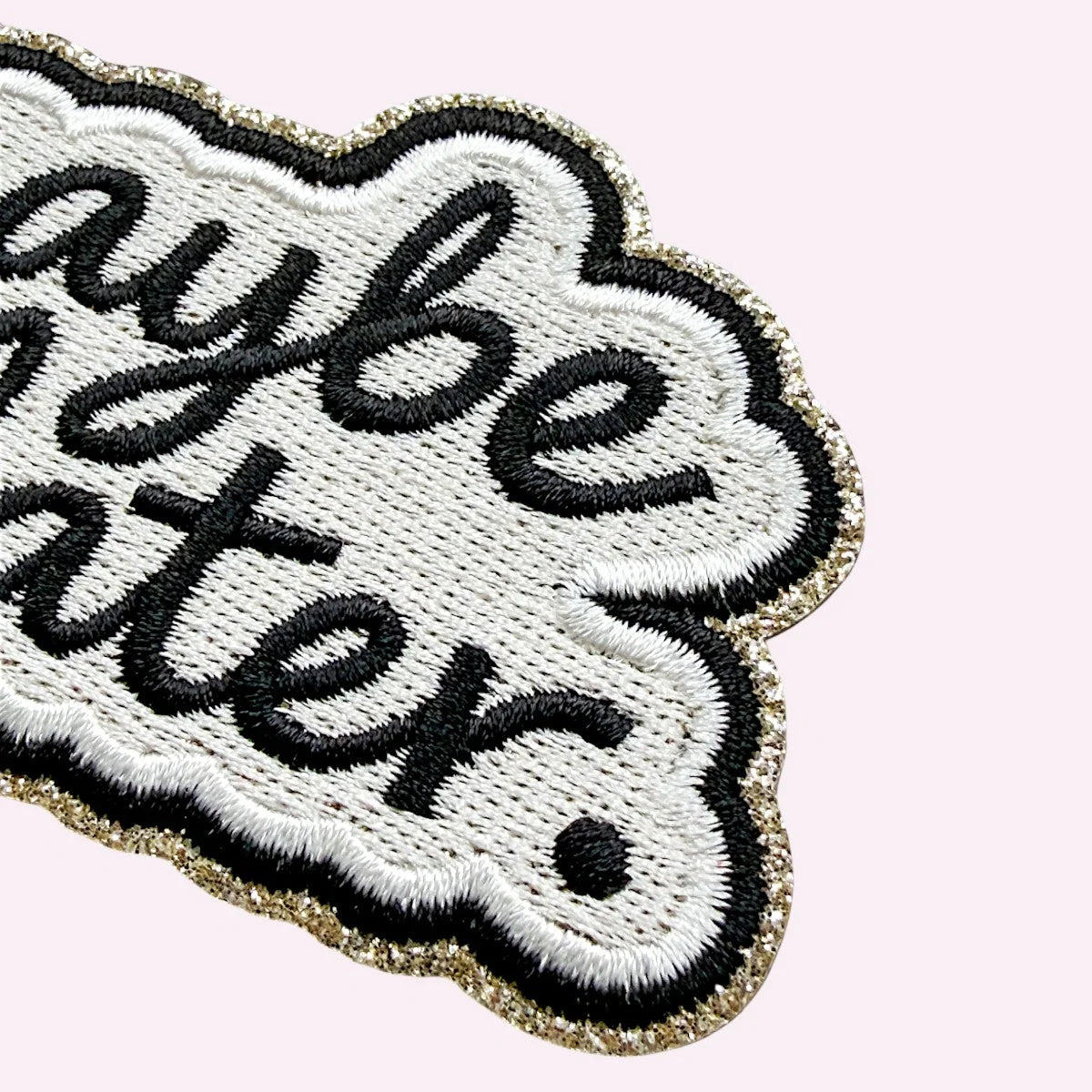 Embroidered sticker reading Maybe Later