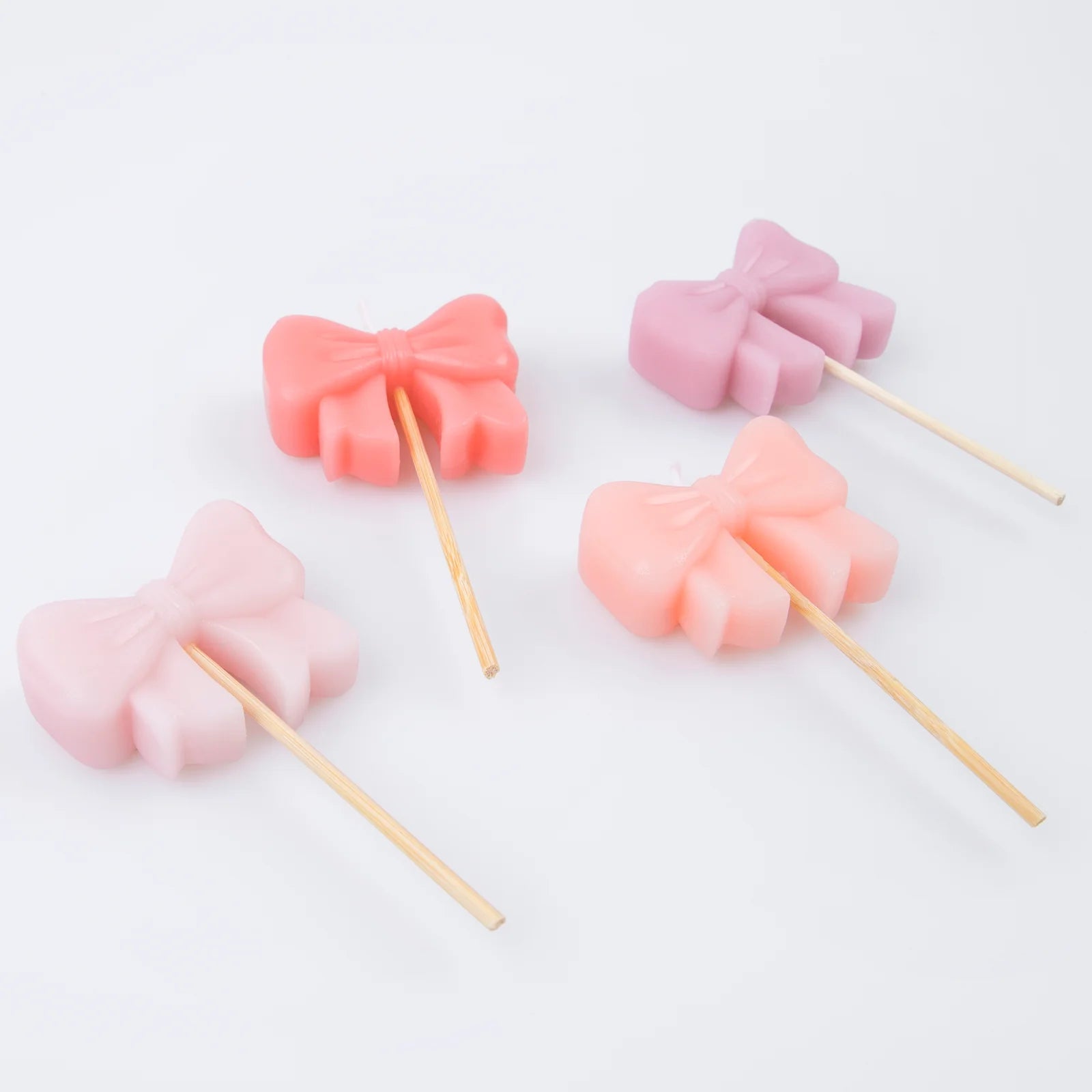 PINK BOW SHAPED CAKE CANDLES - OTHERLETTERS