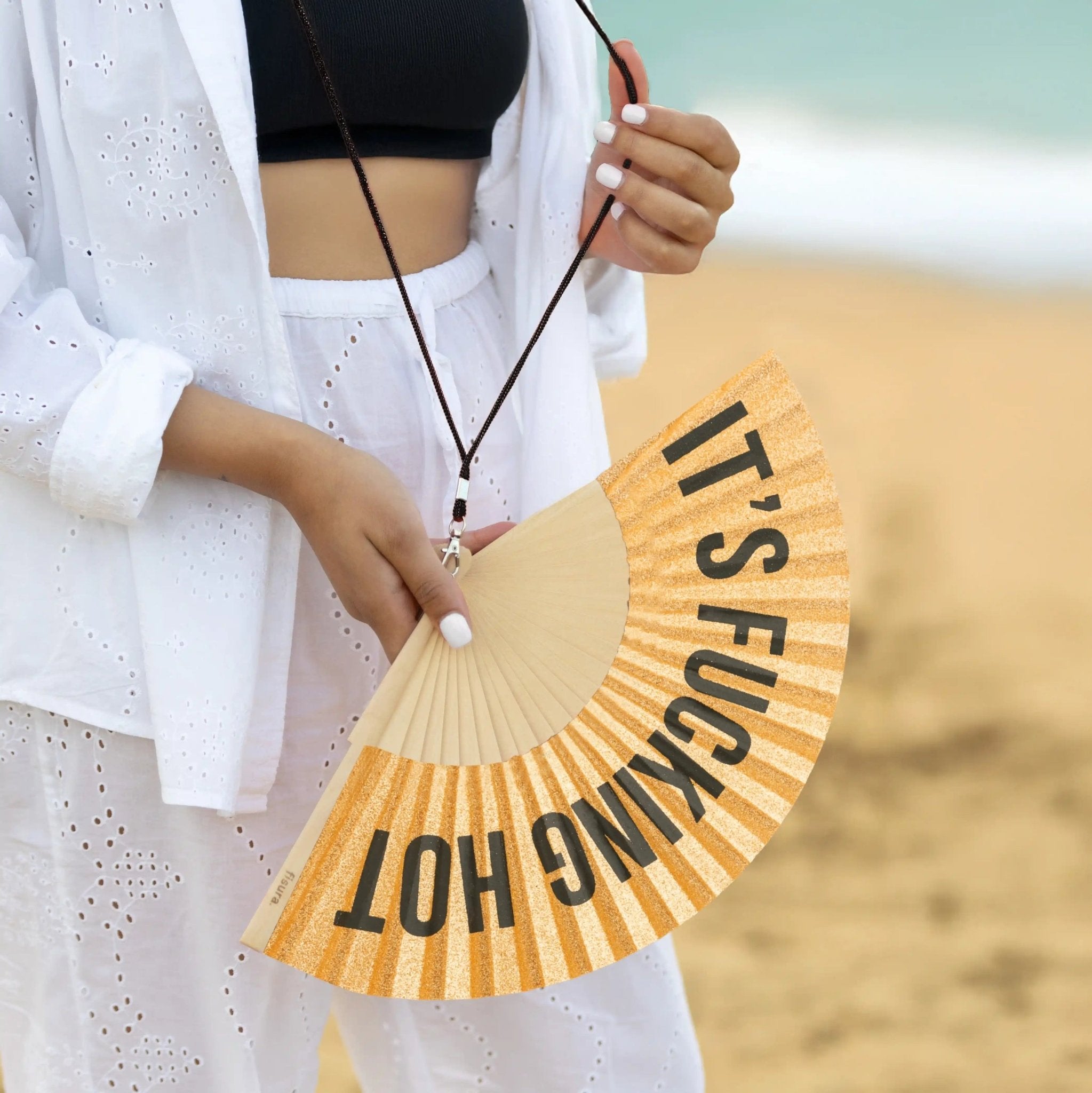 * PRE ORDER * GOLD GLITTER 'IT'S FUCKING HOT" HAND FAN - OTHERLETTERS