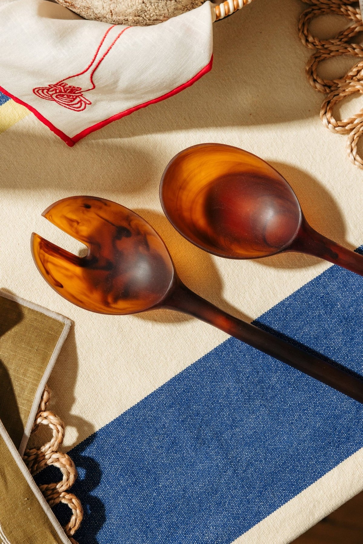 Amber resin salad servers styled on a table