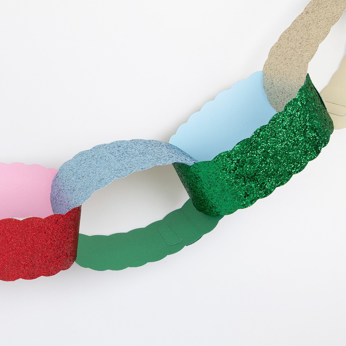 Giant paper chains with a red velvet hanging ribbon
