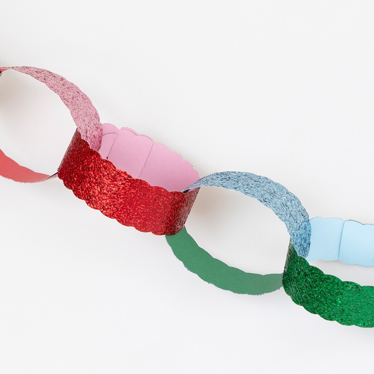 Glitter paper chains with solid complementary colours inside