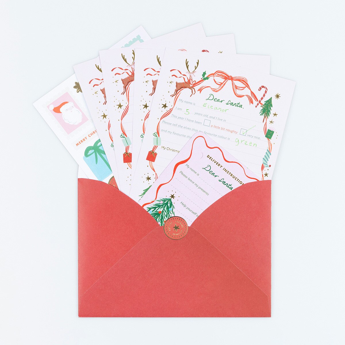 Christmas letter writing kit with shiny gold foil details