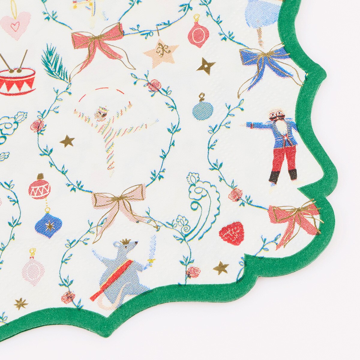 Nutcracker napkins with an ornate green border and gold foil