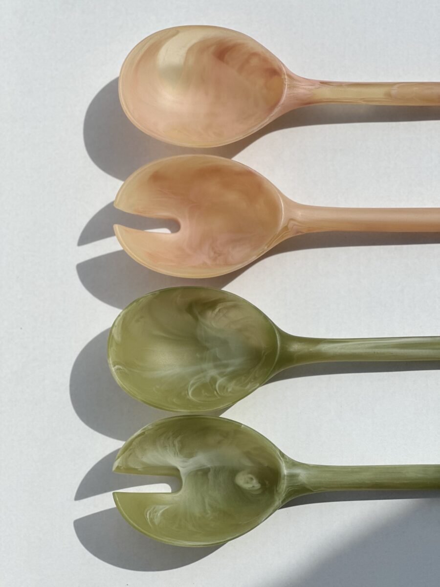 Close-up of the coral resin salad server handle