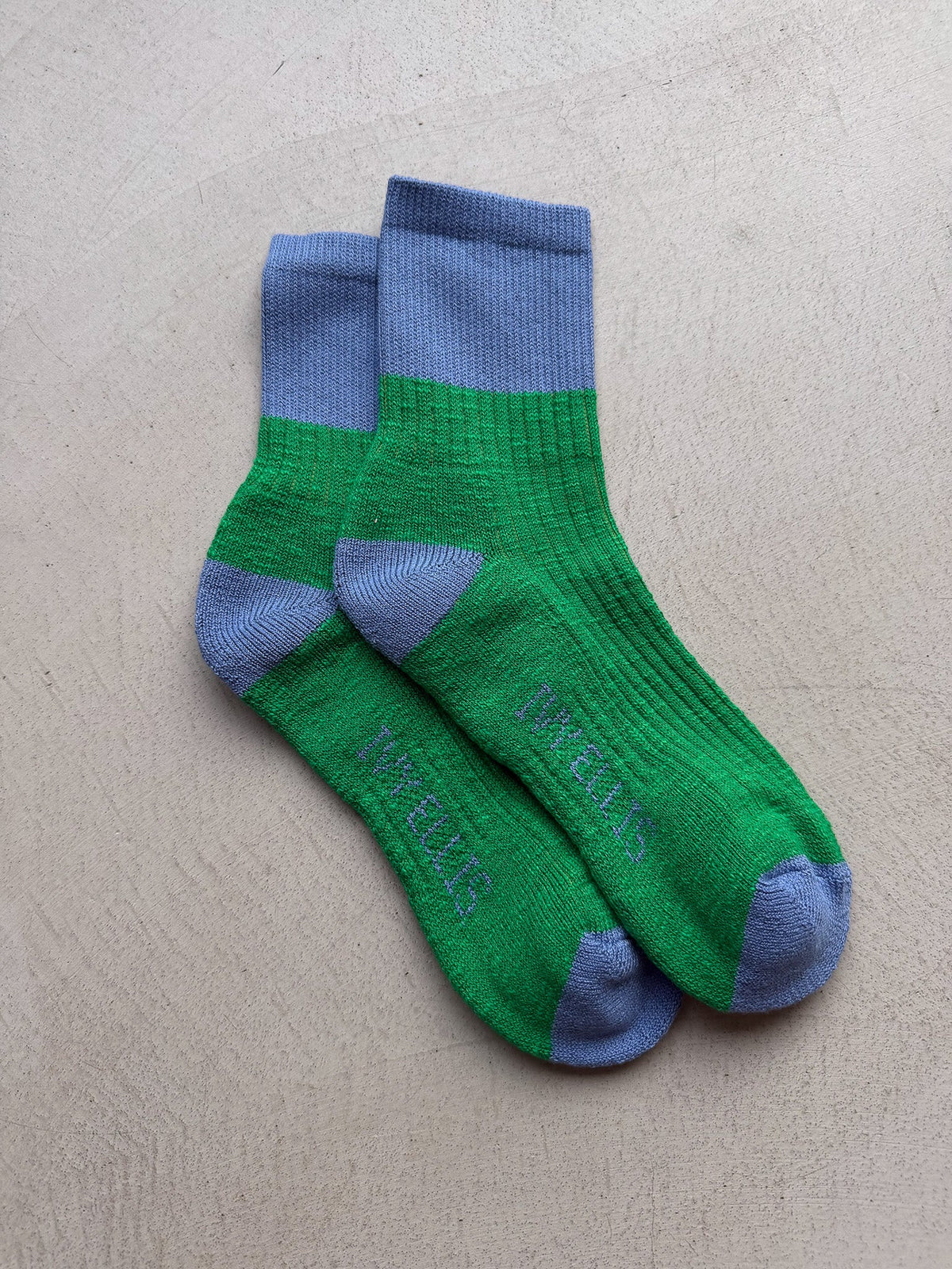 The Boris women's quarter length socks by Ivy Ellis in green slub with a blue accent