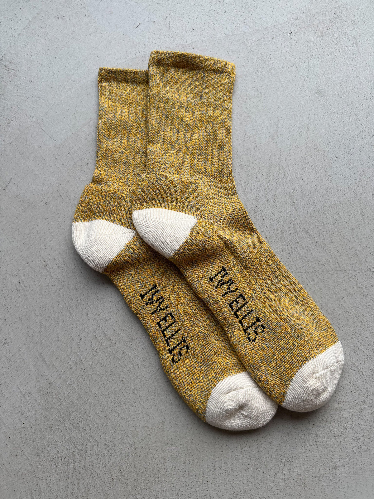 The Half Dome women's quarter length socks by Ivy Ellis in mustard gold marl with a cream heel and toe
