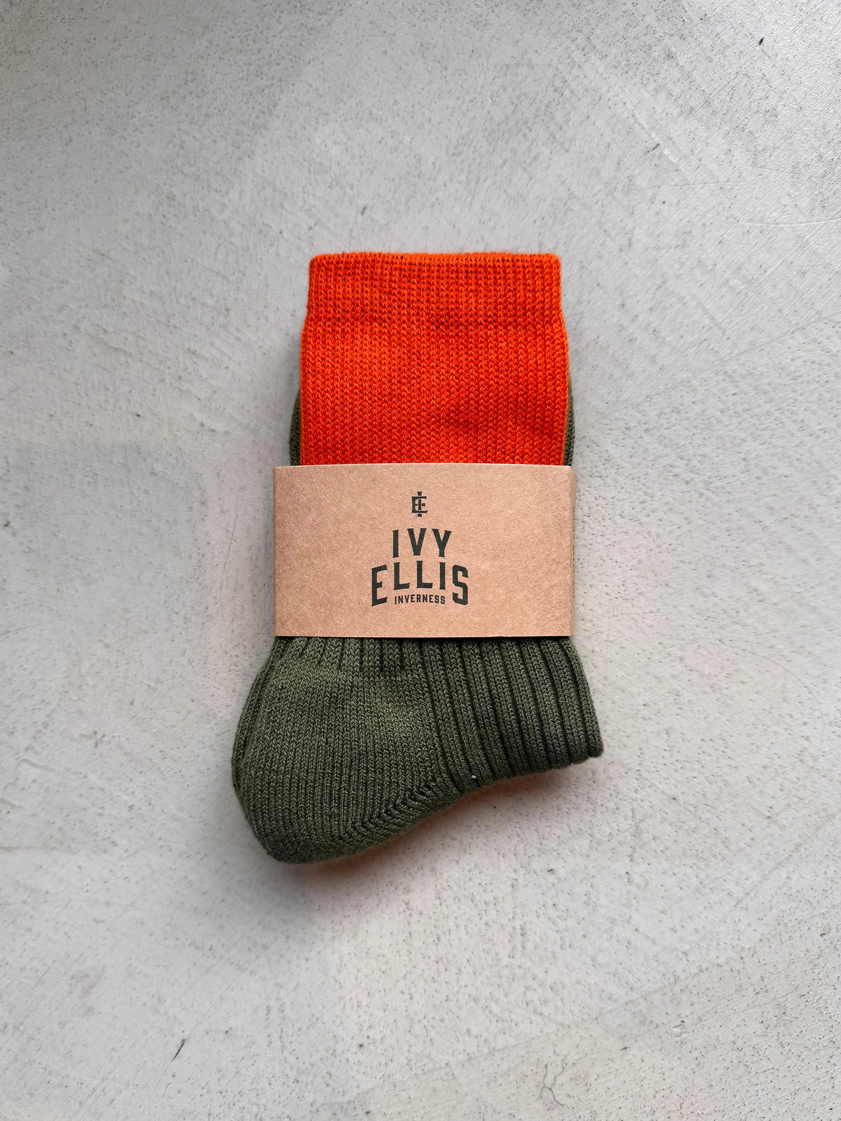 The Deerhunter men's crew length socks by Ivy Ellis in blaze orange and deep green