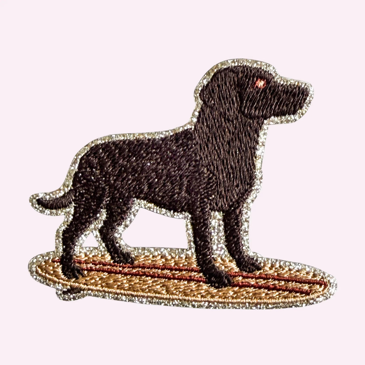 Embroidered sticker of a surfing Labrador