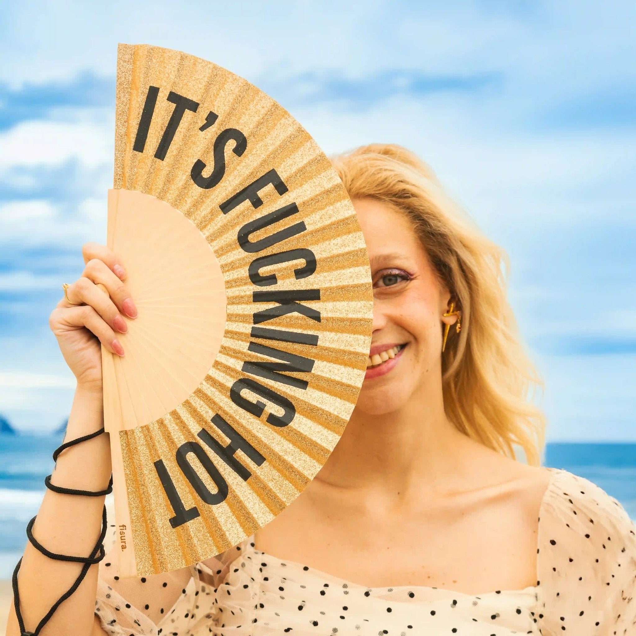 * PRE ORDER * GOLD GLITTER 'IT'S FUCKING HOT" HAND FAN - OTHERLETTERS