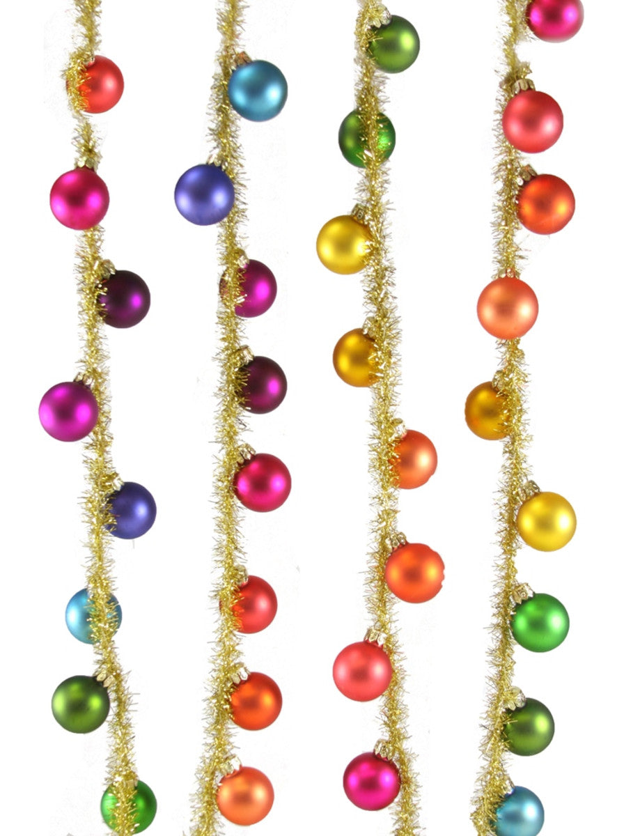 Gold tinsel garland with rainbow baubles for party decoration